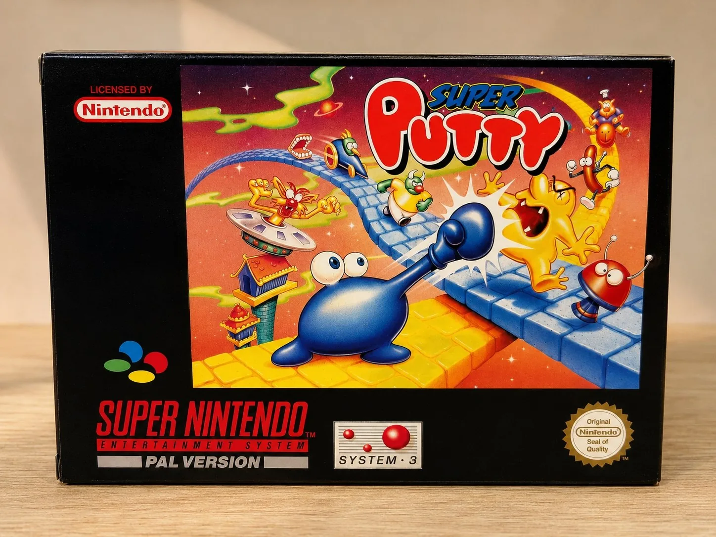 Frontal de la caja repro Super Putty para SNES