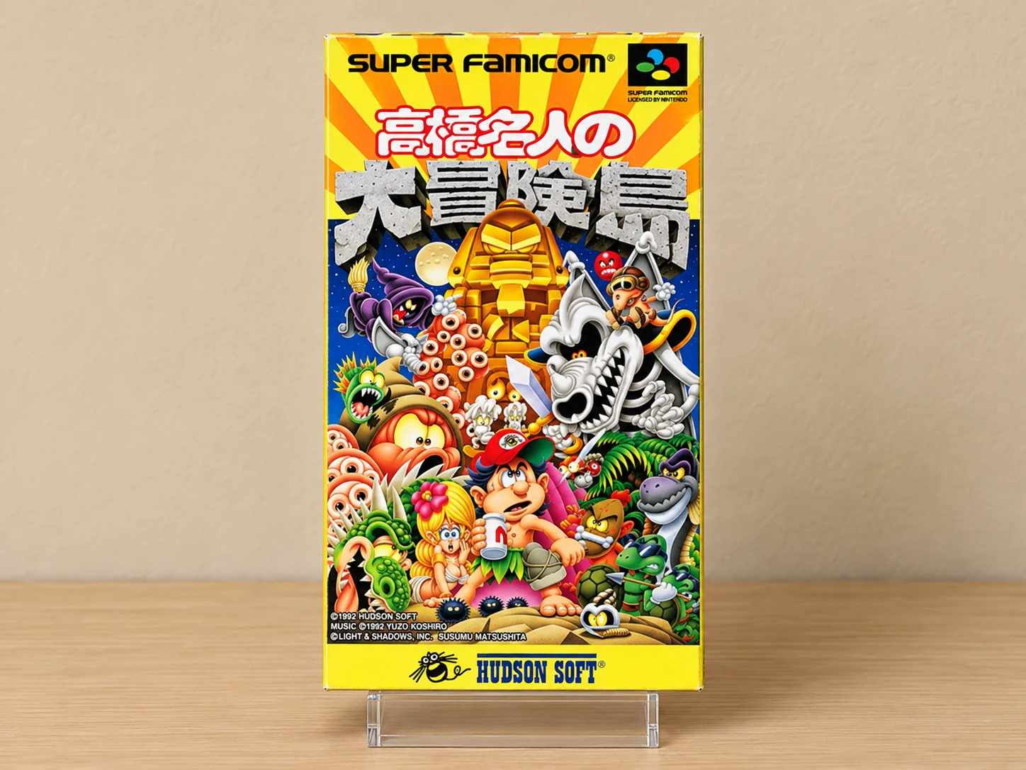 Caja repro japonesa de Super Adventure Island para Super Famicom, portada completa sobre expositor